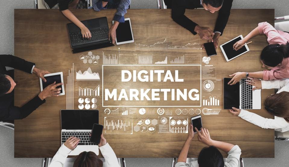 Picture of digital marketing sign with people sitting at the table 