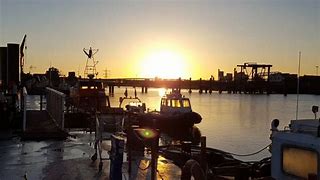 Image of a sunlit boatyard that you could be working on.