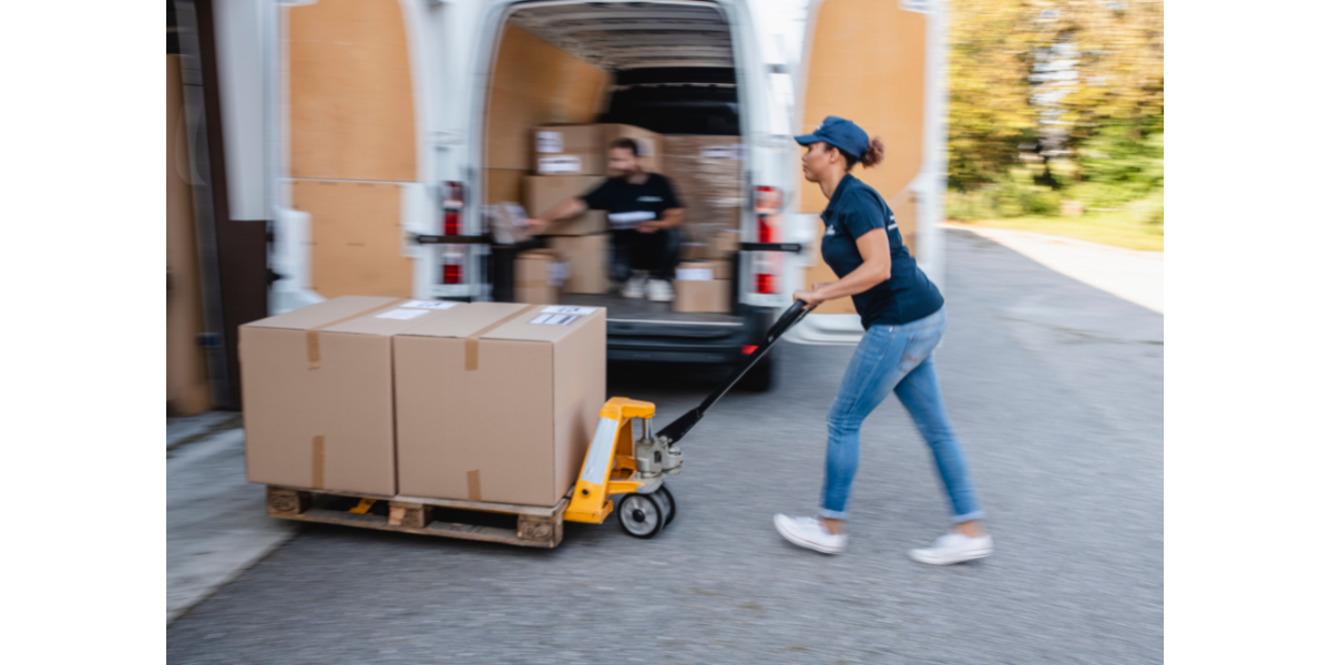 A deliverer using a trolley for heavy orders