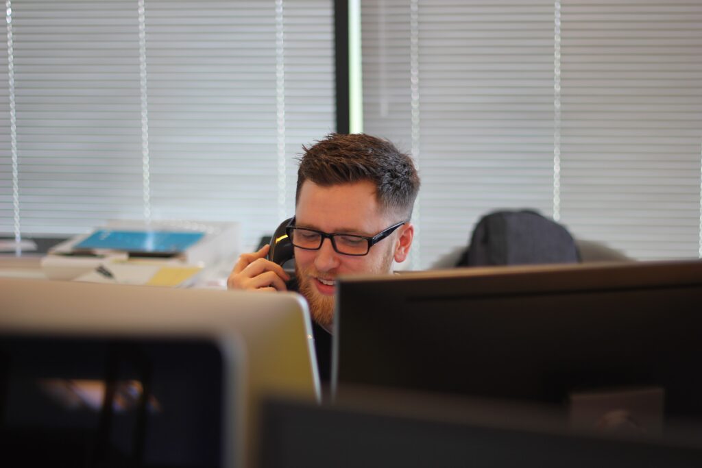 People-man-at-desk-on-phone