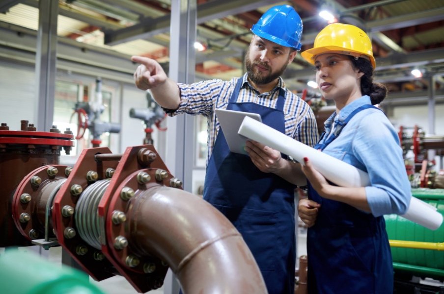 Apprentice and mentor looking at pipes for her Water Process Operations apprenticeship