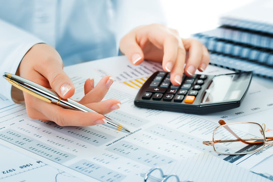 Accountant using a calculator