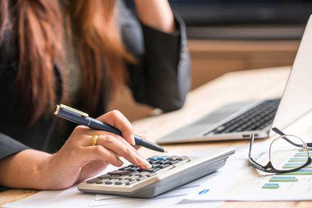 Apprentice using calculator for accounting 