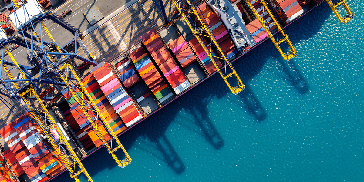 Aerial view of a port with cargo and heavy machinery